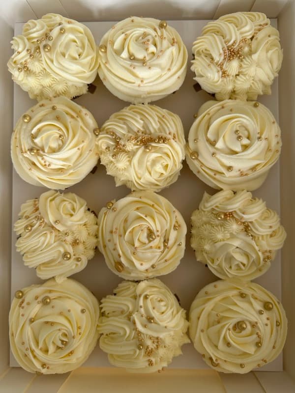 White rose cupcakes with gold pearls