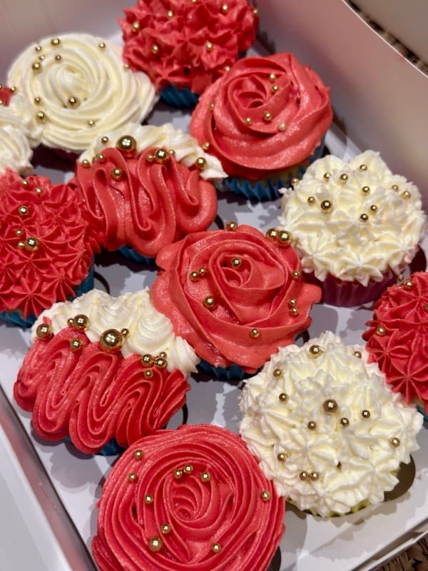 Red and white cupcakes with gold accents